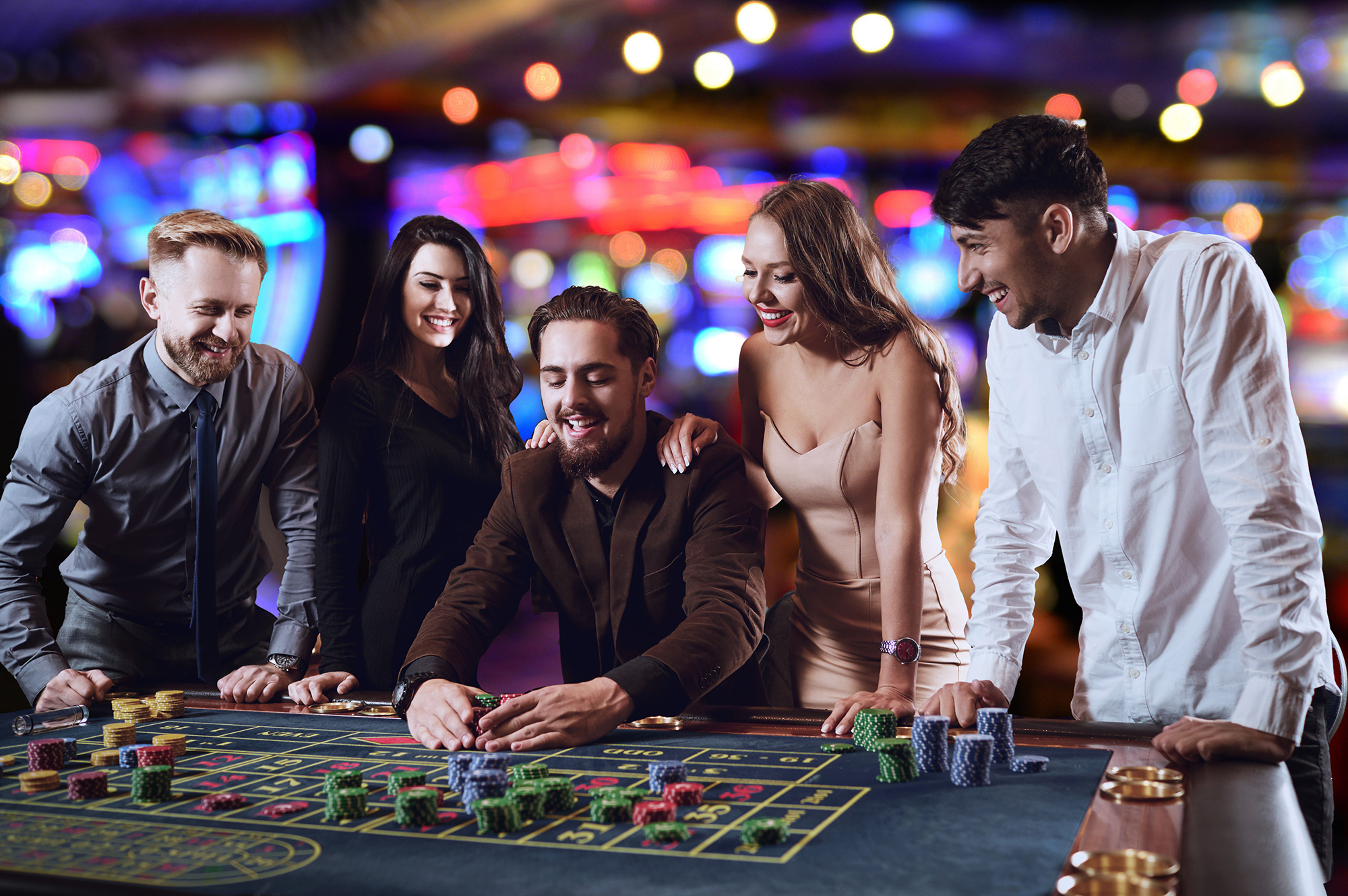 Friends playing roulette at table