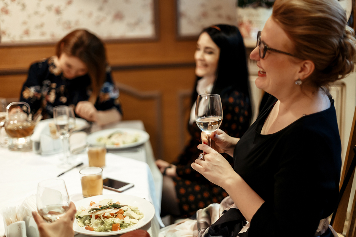 Friends laughing at dinner