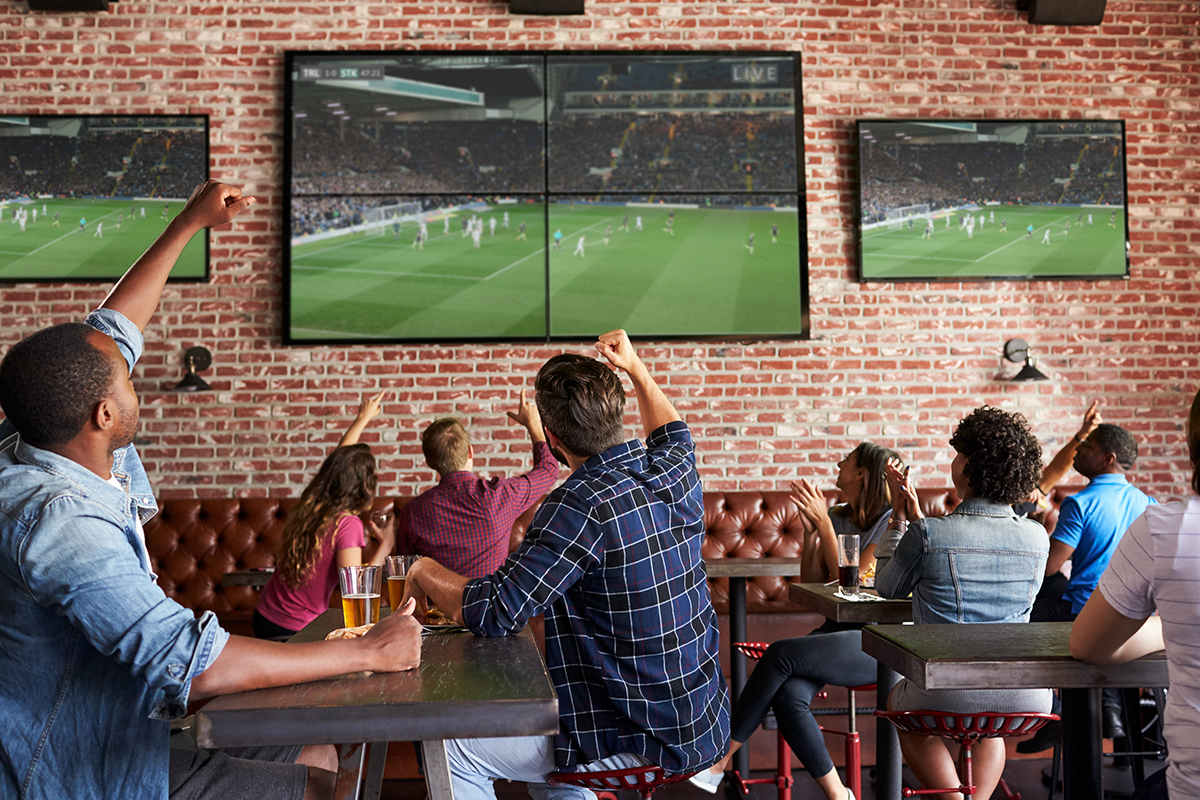 Cheering at sports bar