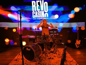 Lady banging the drums in Revo Casino and Social House