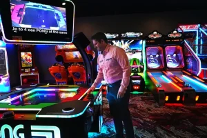 man playing arcade games in Revo Casino and Social House