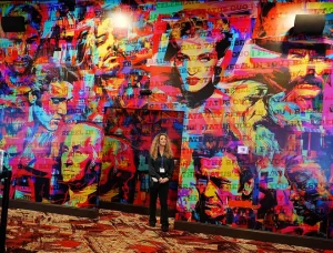 Lady standing by Rebel wall in Revo Casino and Social House