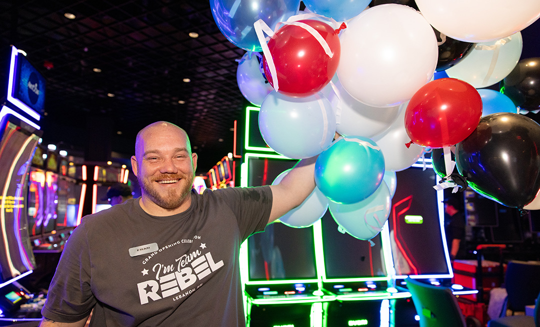 Team Member with balloons