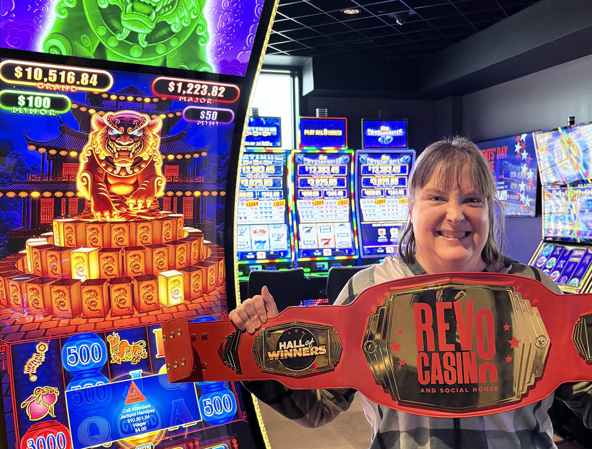 Woman wit Revo Belt at a lot machine